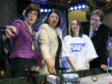 Mayor of Galway Hildegarde Naughton, Commissioner, Gesiue Stanienda from SAP, and President of NUI Galway Dr. James Browne check out the Lego competition at the Galway science exhibition.
