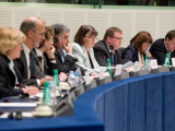Commissioner (centre) addresses the ITRE Committee of the European Parliament