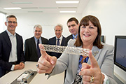 Medtronic Vice Presidents, Mr. Sean Salmon , Mr Mike Coyle, Mr Steve Oesterle and Mr Gerard Kilcommins, at the opening of the Medtronic Global Innovation centre at Medtronic, together with Commissioner Geoghegan-Quinn.