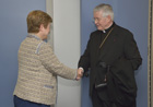 Handshake between Mgr Alain Paul Lebeaupin, on the right, and Kristalina Georgieva