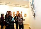Kristalina Georgieva, on the right, looking at a sculpture showcased at the exhibition "Spiritual roots"