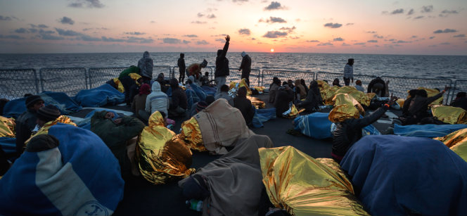 Migrants on the Mediterranean from Pakistan, Sudan, Syria and other countries, aboard an Italian naval vessel. Photo: UNHCR / A. D'Amato