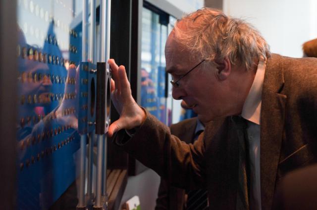 Man examining euro coins