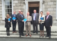 Gerry Kiely being presented with the Seanad report