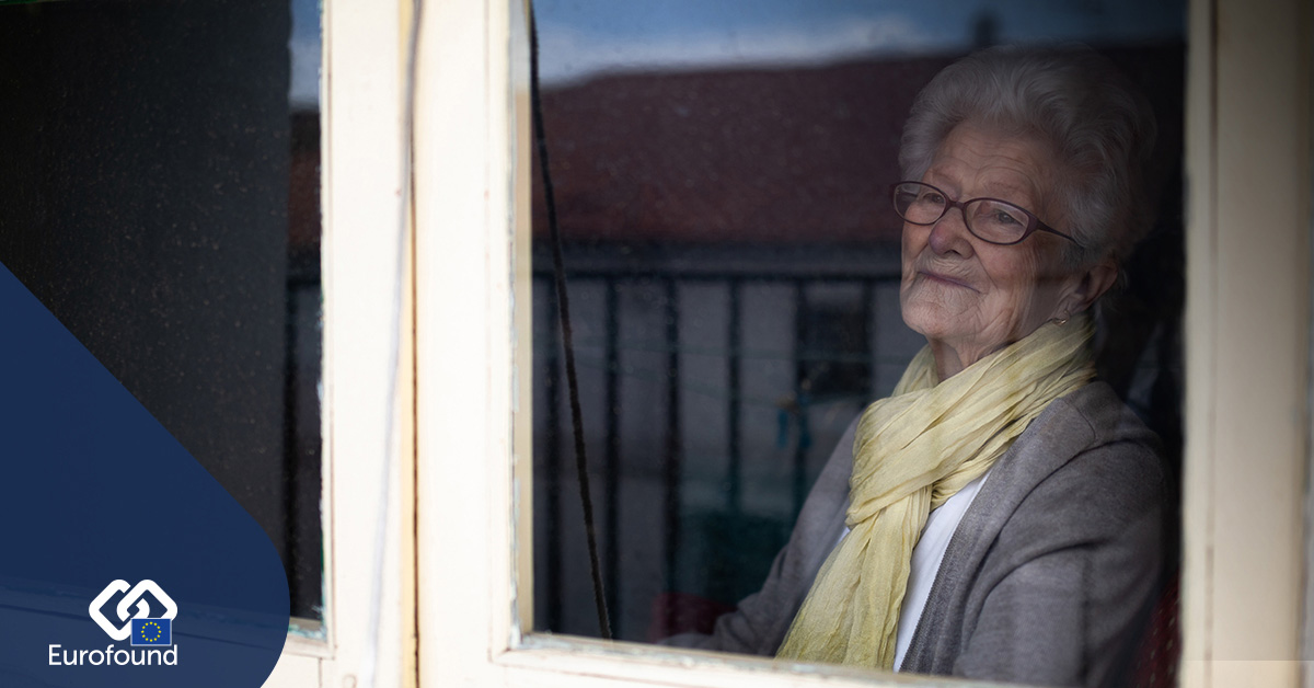 Elderly woman looking at the window