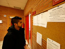 Young person looking at offers on job board
