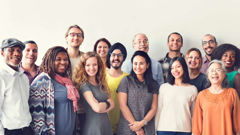 A group of people with different nationalities stand together