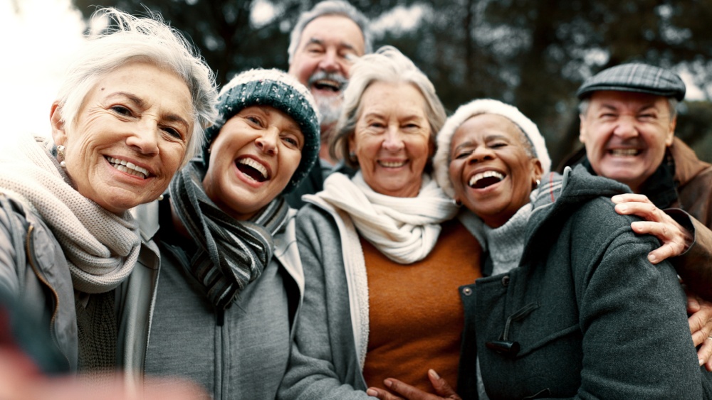 A group of older people sharing a laugh.