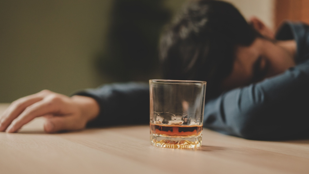 Young male suffering alcoholism