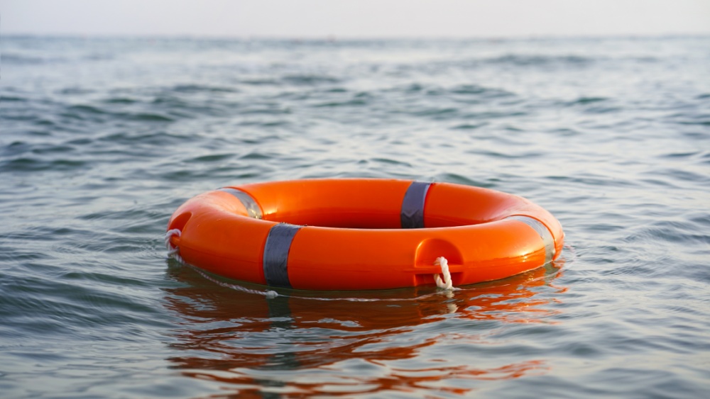 A lifebuoy floating on water.