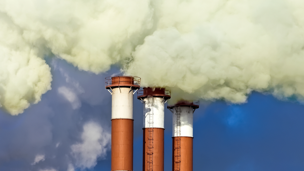 Industrial chimneys emitting air pollution