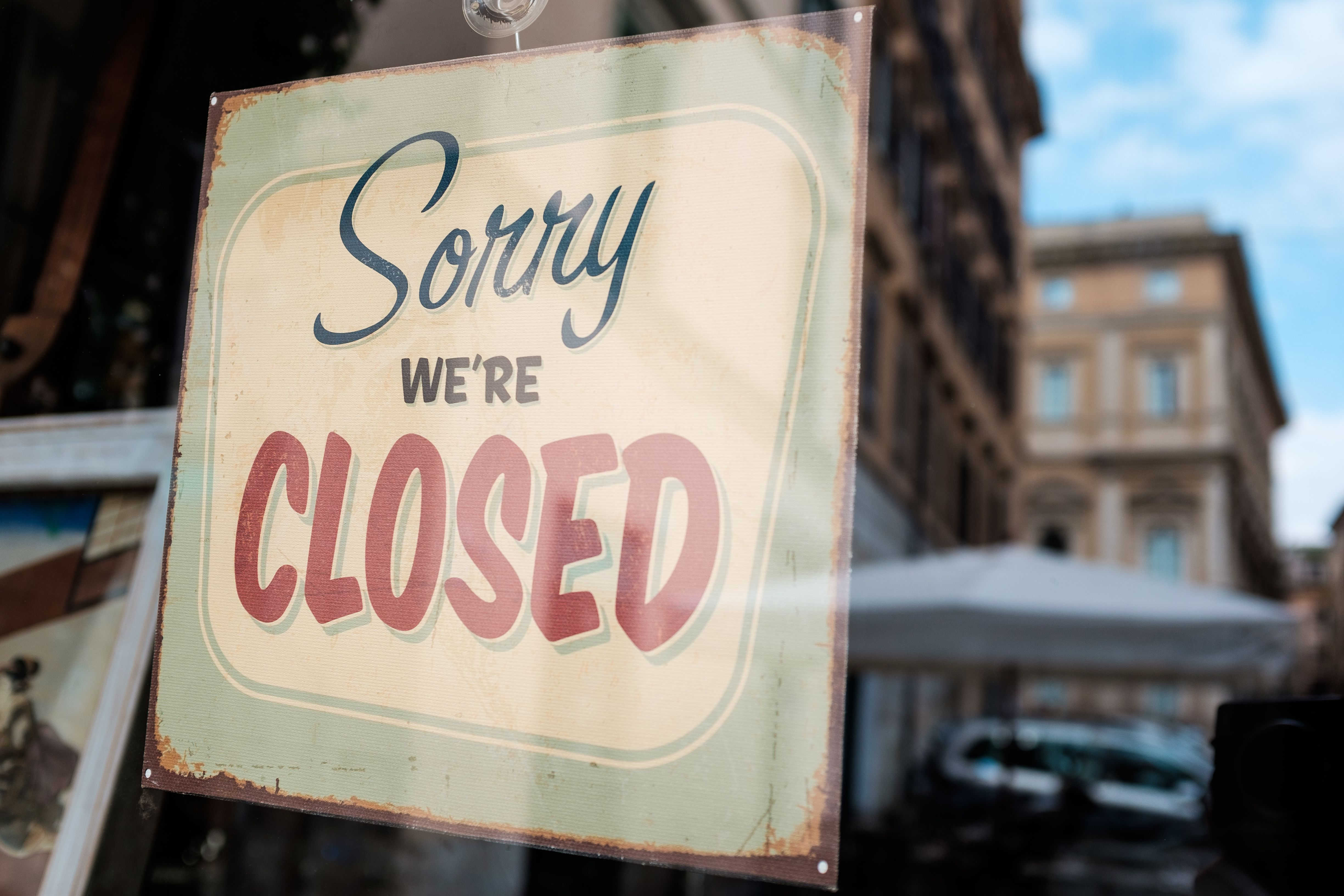 A sign showing closure of a business.