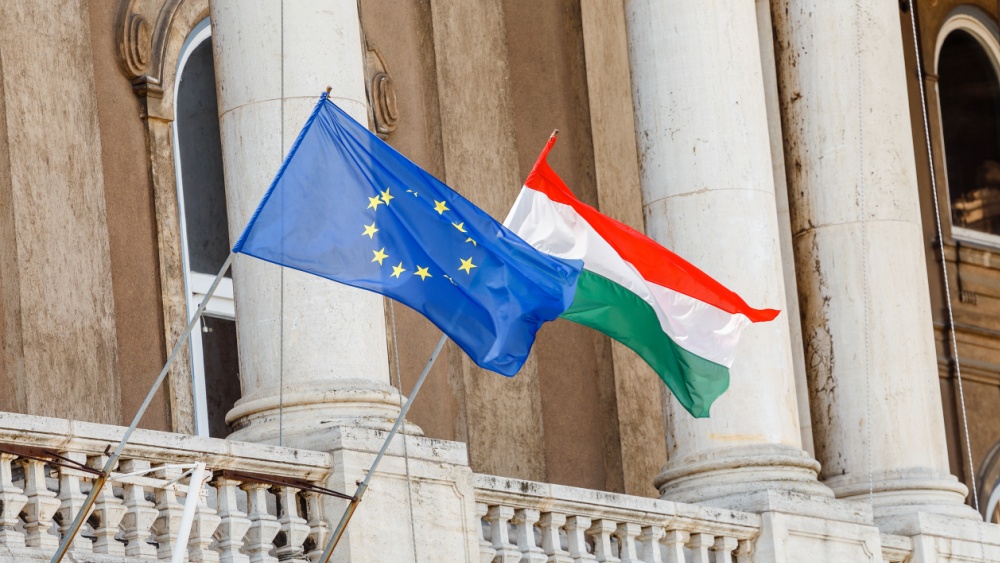 EU and Hungarian flags on a balcony
