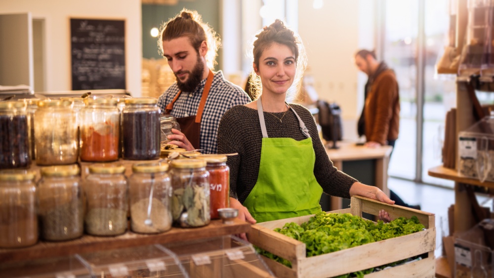 Couple working in a bulk food store