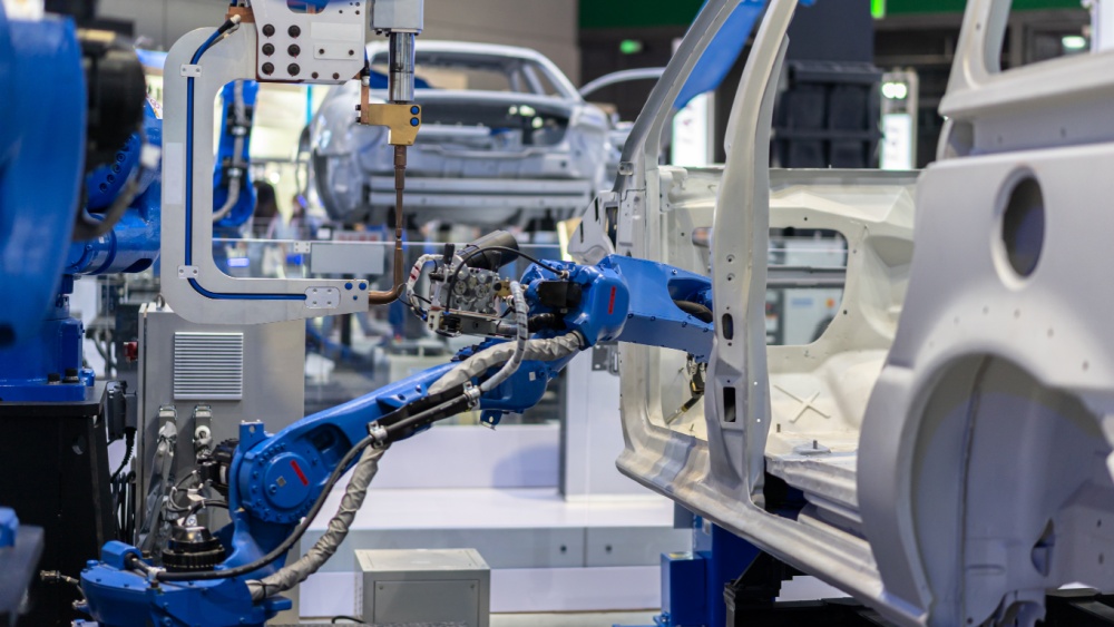Production process by automatised robot in automotive industry.