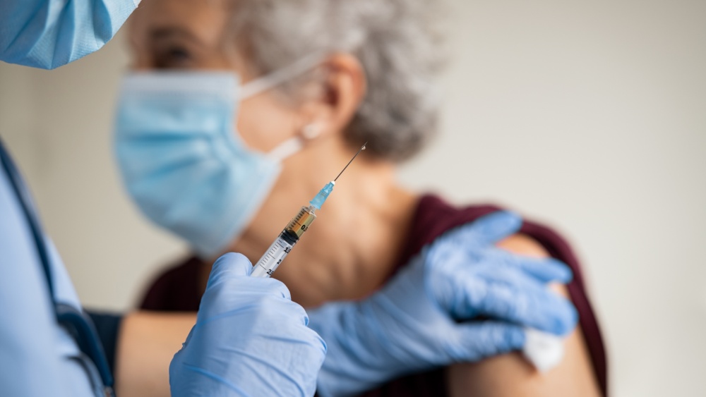 elderly person getting vaccinated.
