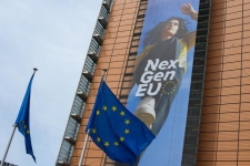 Banner of NextGenerationEU on the front of Berlaymont building showing athlete running