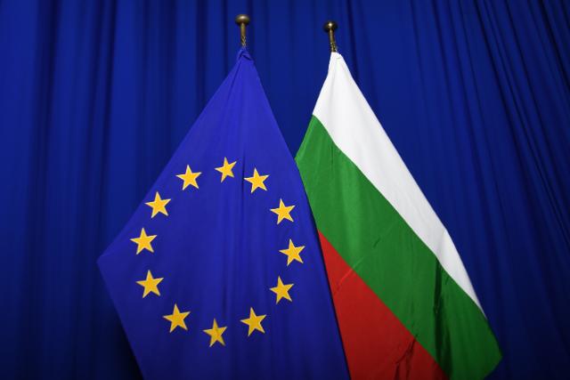 Alt text: The national flag of Bulgaria next to the European flag