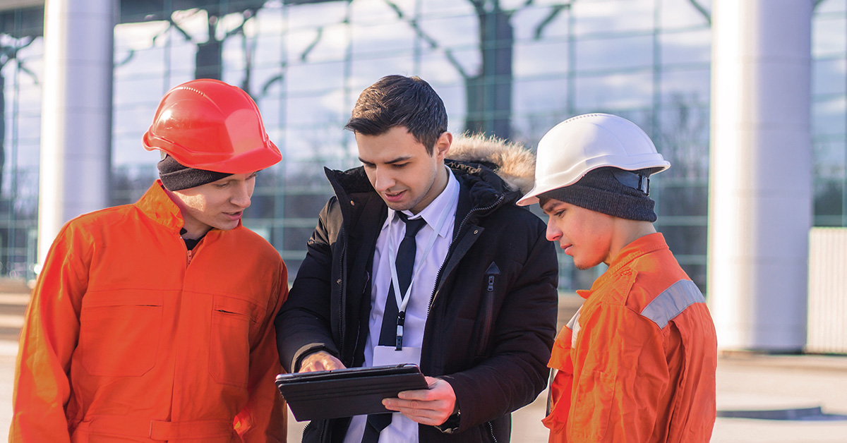 Manager explaining the work details to two young employees