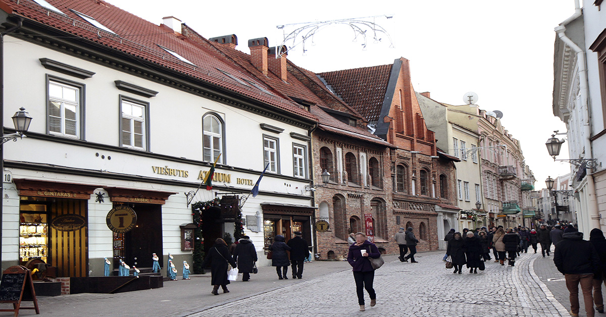 Busy pedestrian street with hotel and shops in Vilnius