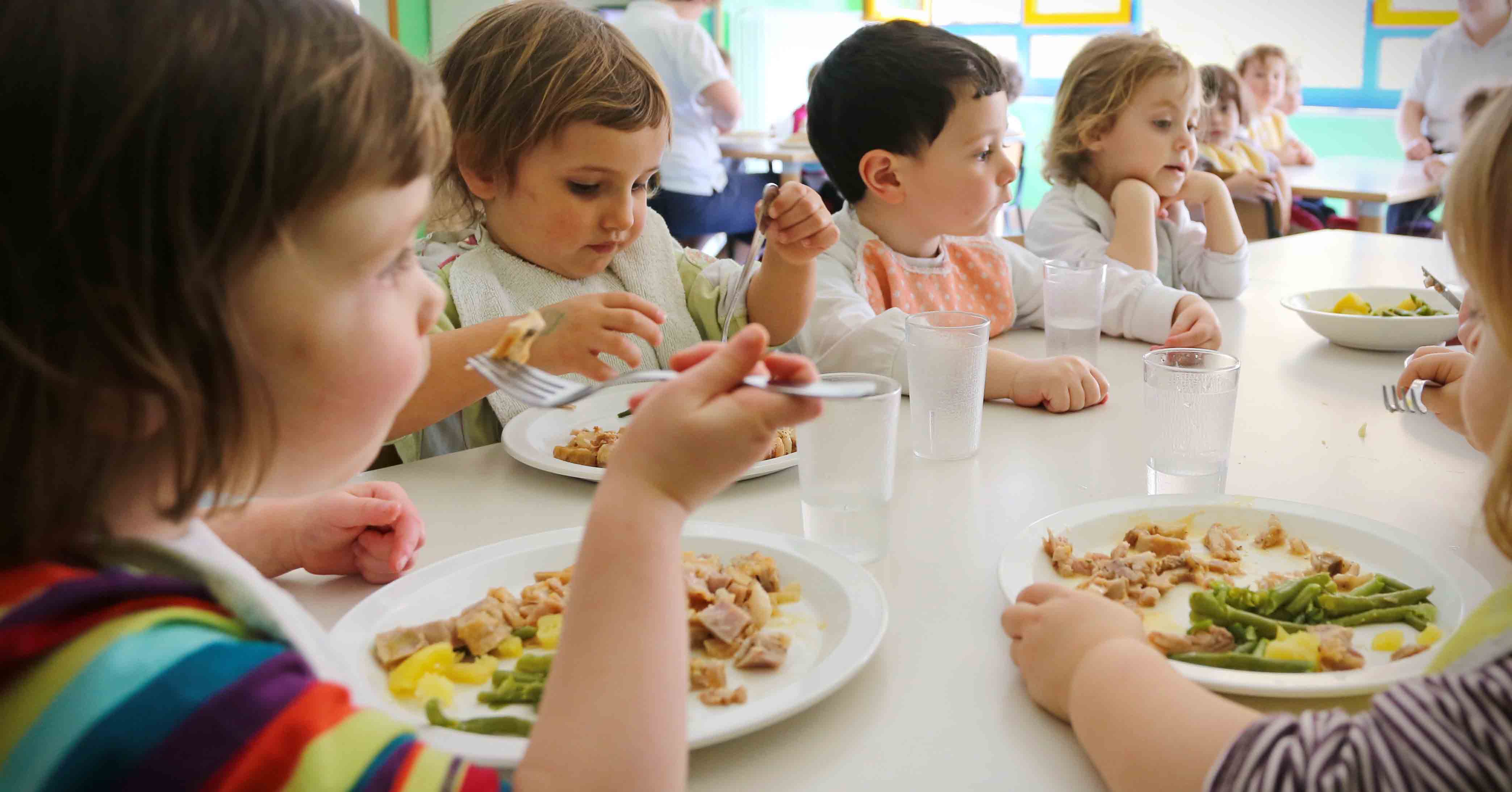 Pupils enjoying lunch at their school canteen