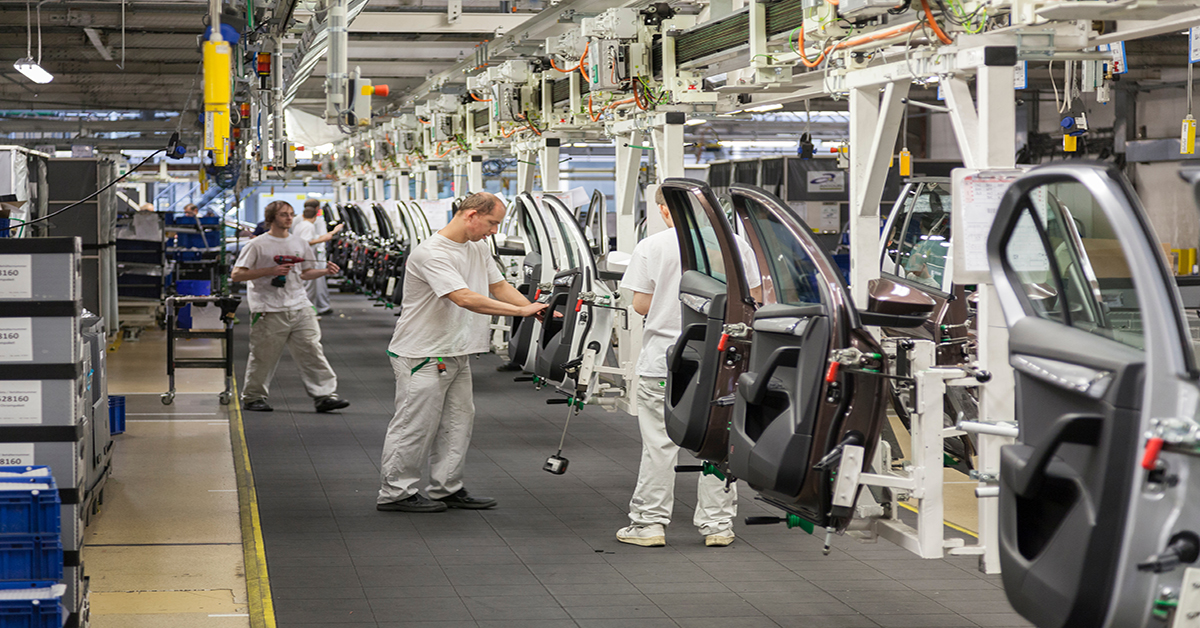 People working in a car plant