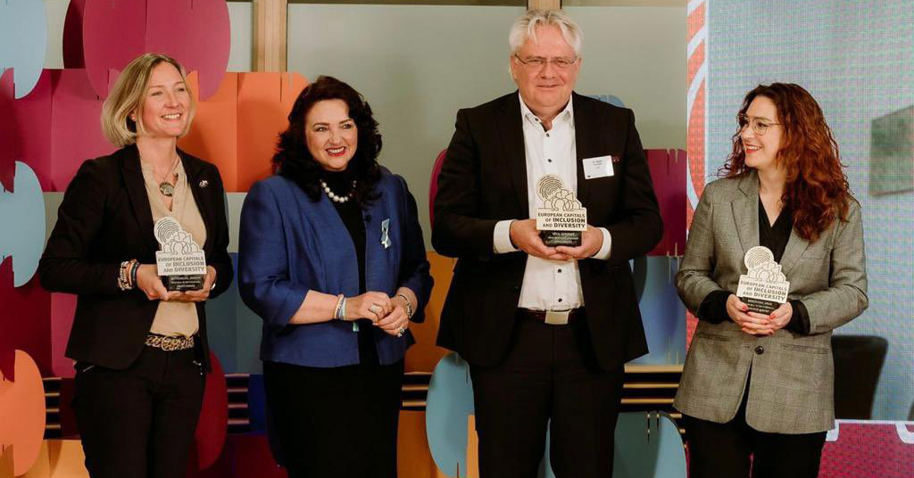 Commissioner Dalli with the winners of Gothenburg (on screen and left), Köln (middle) and Barcelona (right) 