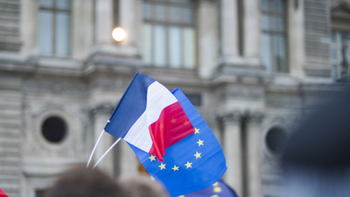 French and EU flags waving
