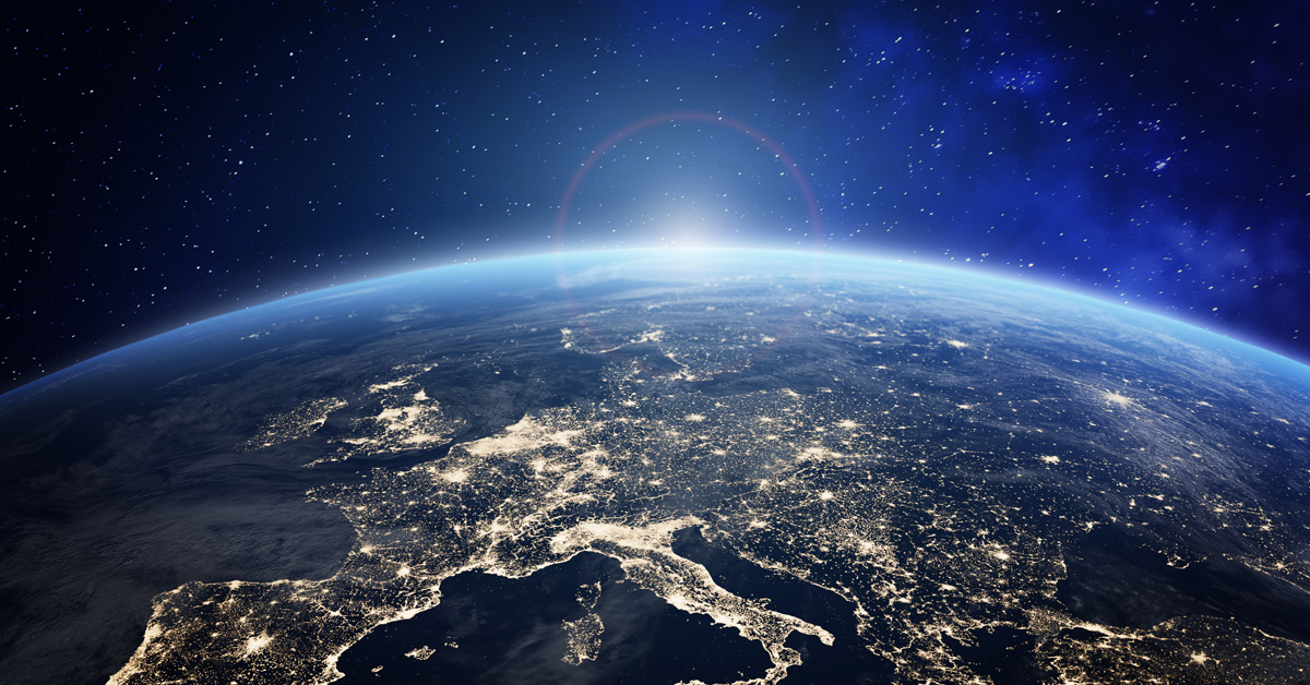 Planet Earth viewed from space with city lights in Europe. World with sunrise. Conceptual image for global business or European communication technology